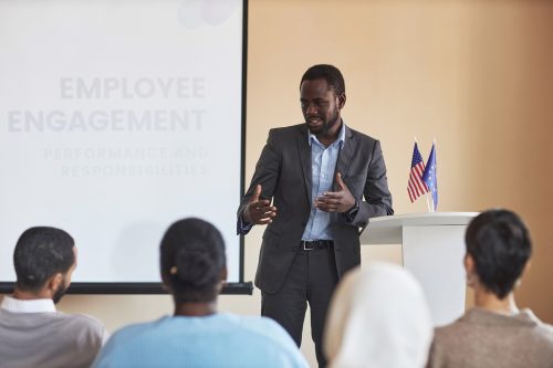 Young,African,American,Male,Deputy,In,Formalwear,Speaking,To,Audience